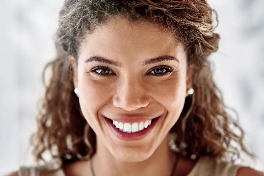 Closeup portrait of a smiling young professional woman